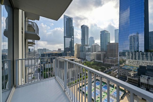 Balcony featuring a view of skyline | Image 16