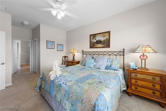 Bedroom featuring visible vents, a ceiling fan, light carpet, a closet, and baseboards | Image 4