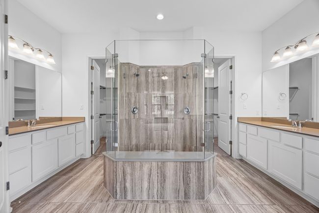Primary Ensuite Bathroom with Dual Vanities + Walk-in Closets | Image 13
