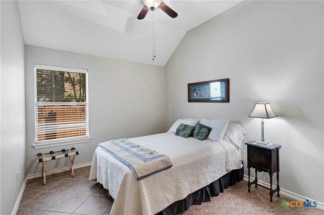 3rd bedroom: high ceiling, ceiling fan, tile floor | Image 11