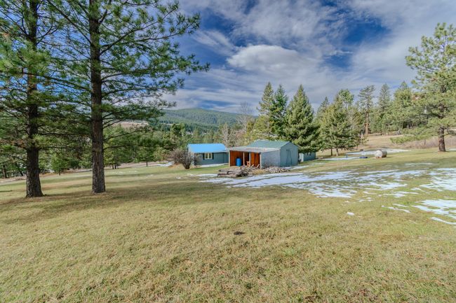 View of yard featuring an outbuilding and a mountain view | Image 77