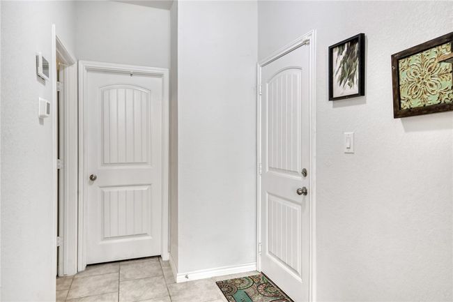 Corridor featuring light tile patterned floors | Image 26