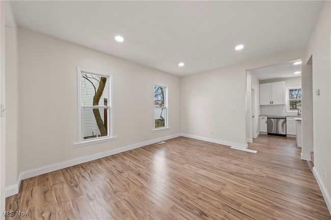 Unfurnished living room featuring light wood-type flooring | Image 7