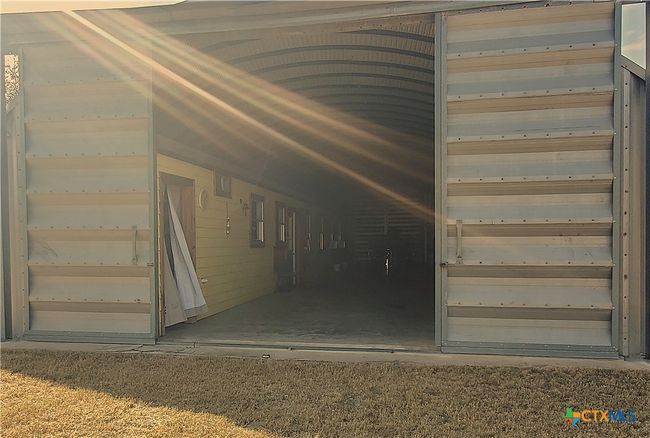 Shows open barn doors (front) to peek at the living area! | Image 4
