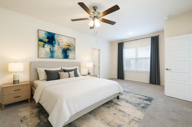 Carpeted bedroom with a ceiling fan and baseboards | Image 15