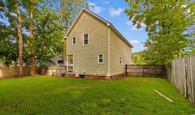 Rear view of house featuring crawl space and a fenced backyard | Image 31