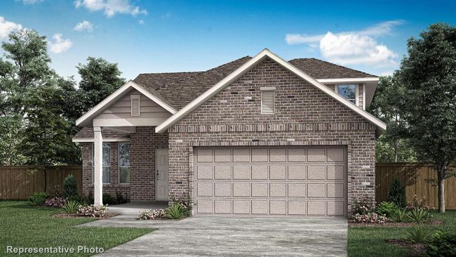 View of front of house featuring concrete driveway, a garage, fence, and brick siding | Image 35