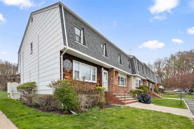 View of front of property with a shingled roof and a front yard | Image 45