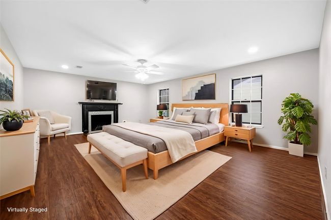 Virtual Staged: The primary bedroom has its own cozy fireplace as well as en-suite bath. | Image 29