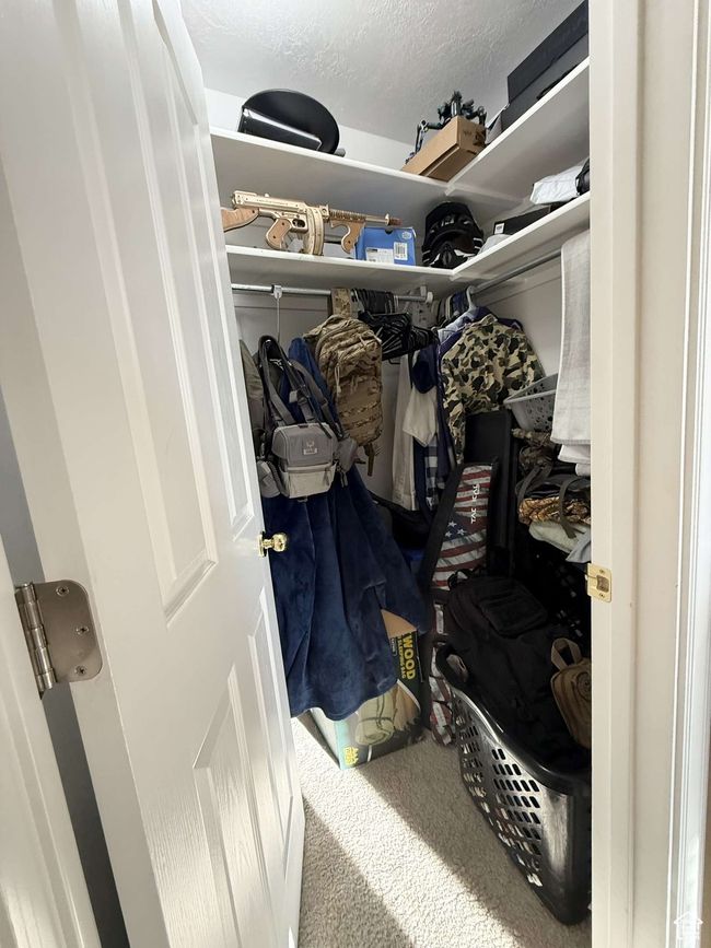 Spacious closet with carpet flooring | Image 34