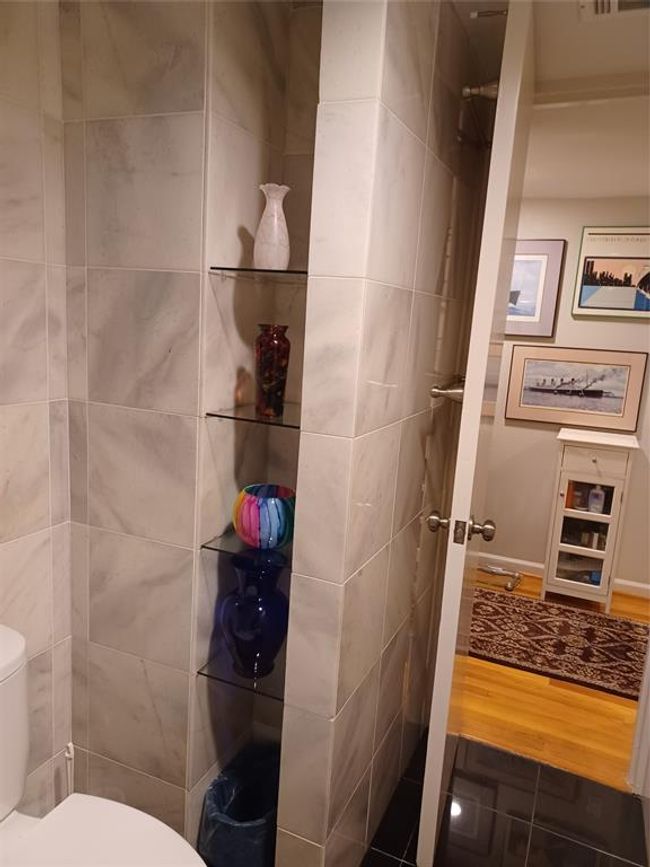 The tub/shower combo and toilet. | Image 17