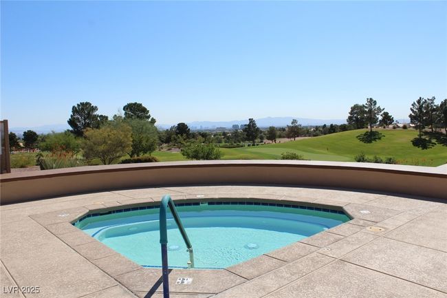 View of pool with view of golf course, a lawn, and a mountain view | Image 31