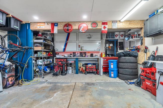 Garage with a workshop area | Image 34