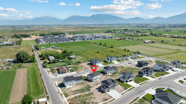 Aerial view of sparsely populated area with a mountain backdrop | Image 40