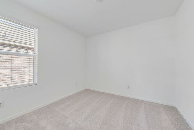 Spare room with healthy amount of natural light and light carpet | Image 17