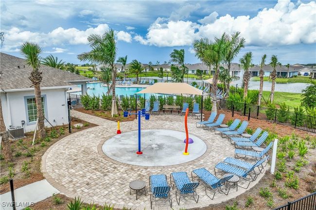 View of playground featuring a community pool, central AC, a patio, and a water view | Image 21