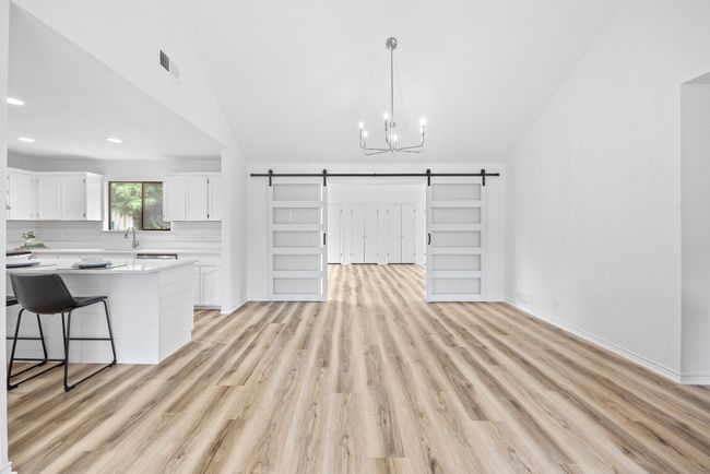 Dining area looking into second living area and kitchen | Image 6