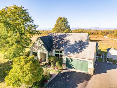 View of front of house with a mountain view and a garage | Image 2