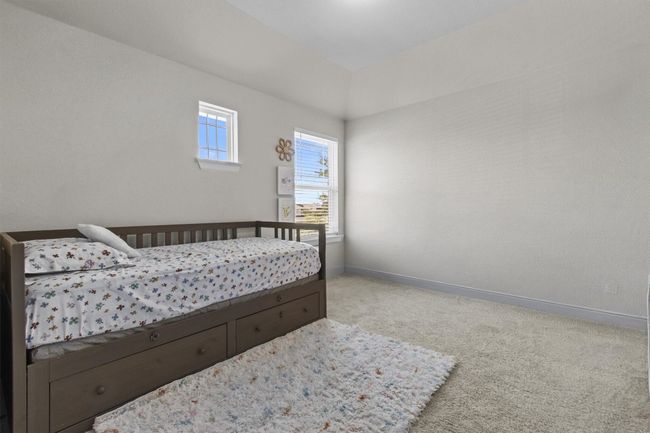 Bedroom featuring carpet flooring and baseboards | Image 29