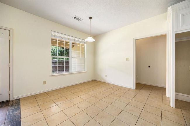 This dining area is large enough to fit a full size table and has a great view of the backyard. | Image 14