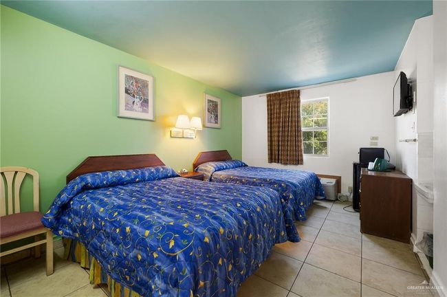 Bedroom featuring tile patterned flooring | Image 13
