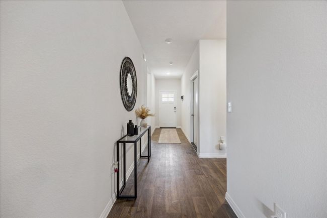 Hallway with baseboards and dark wood-style floors | Image 5