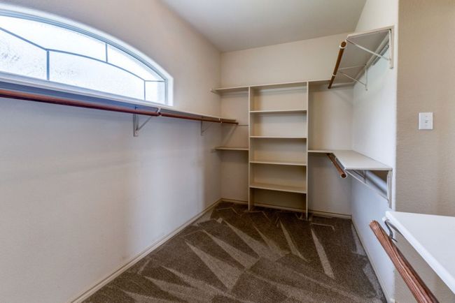 Spacious closet with carpet flooring | Image 21