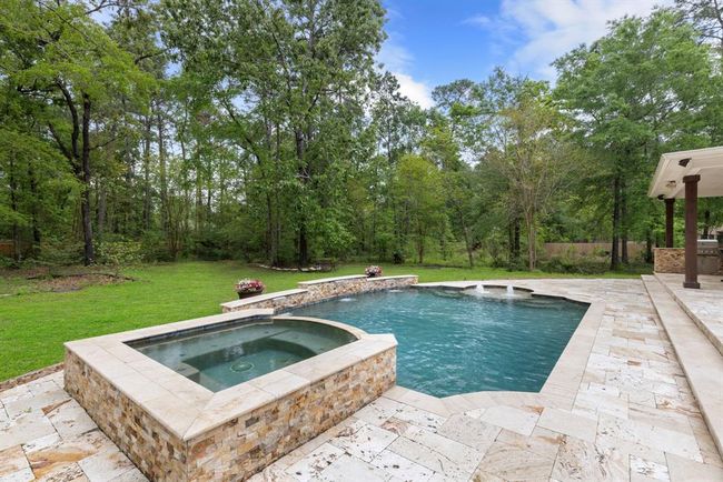Home sits in the center of the two acres with sides left wooded and natural. | Image 33