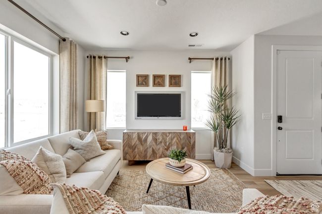 Living area featuring wood finished floors and recessed lighting | Image 31