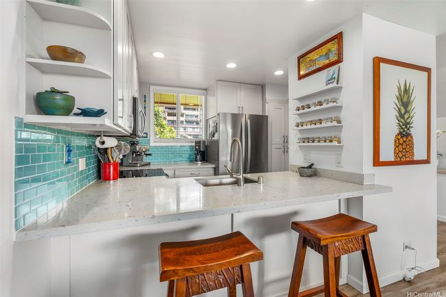 Open kitchen and counter seating is ideal to carry on great conversations with friends and family | Image 12