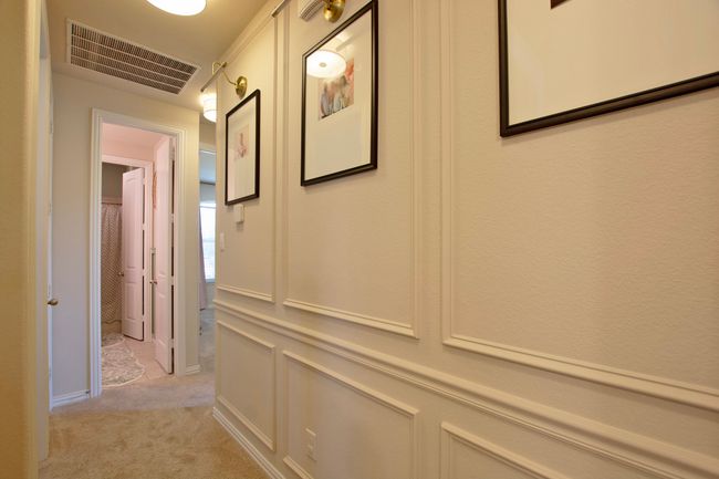 Hallway featuring visible vents and light colored carpet | Image 24