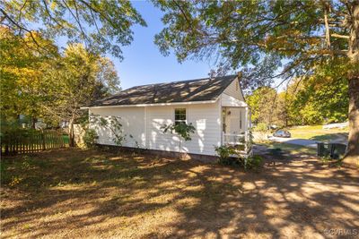 View of side of property with a lawn and an outdoor structure | Image 1