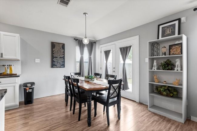 Dining area and backdoor | Image 13