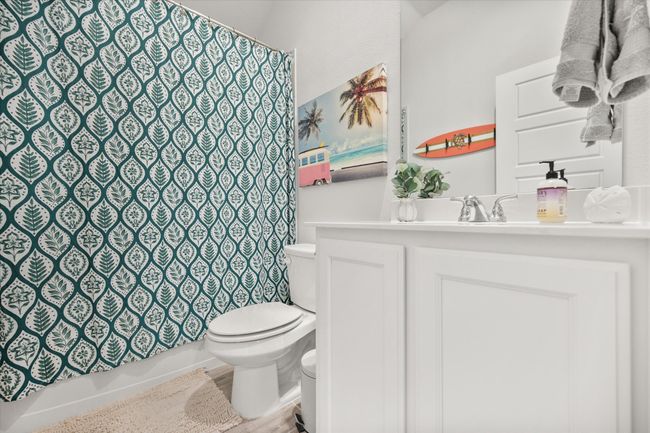 Full bath featuring vanity and wood finished floors | Image 19