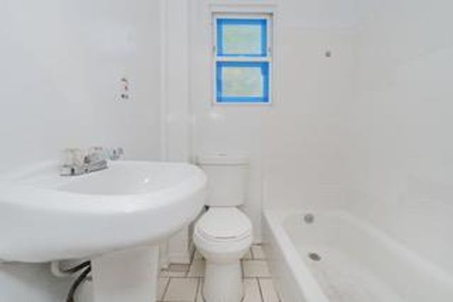 Bathroom with toilet and tile patterned flooring | Image 31