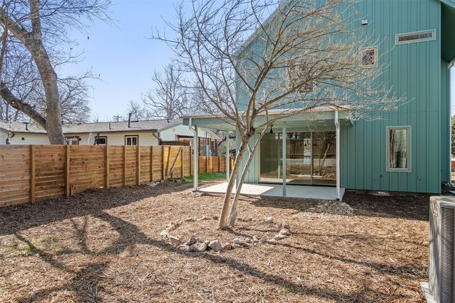View of yard featuring central AC, a patio area, and a fenced backyard | Image 21