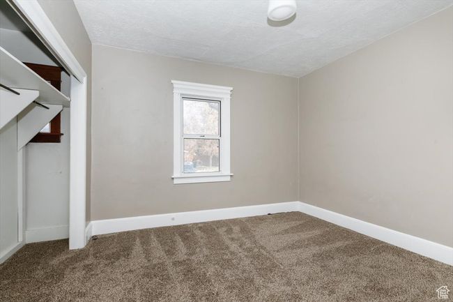Rear view of property with a yard and brick siding | Image 24