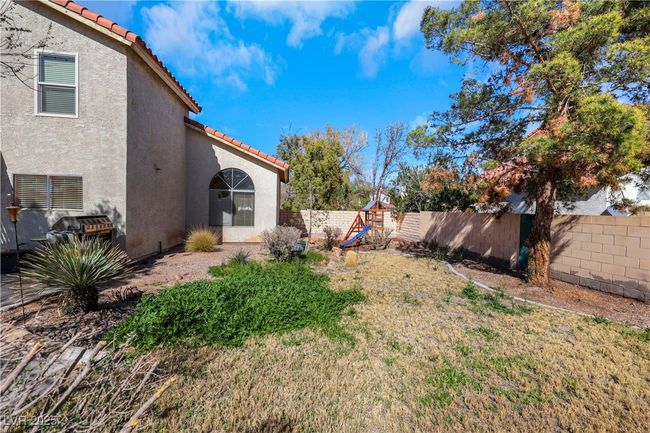 View of yard featuring fence and a playground | Image 39