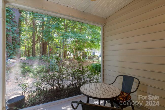 Screened in back patio overlooking wooded area | Image 24