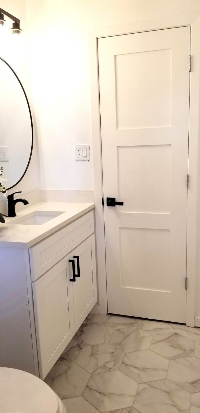 Bathroom featuring vanity and marble finish floors | Image 27