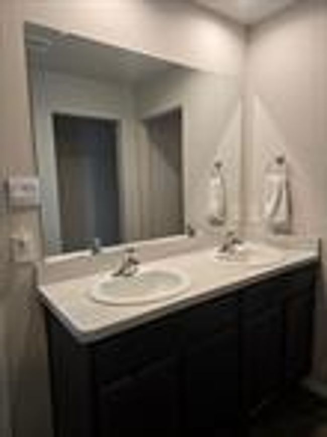Primary bathroom has double sink | Image 11