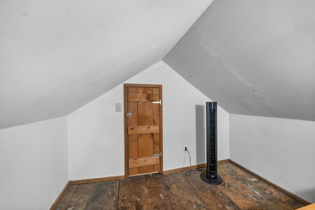 Bonus room featuring hardwood / wood-style flooring, vaulted ceiling, and baseboards | Image 16