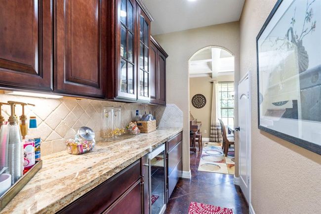 Butler's pantry with wine fridge that conveys with the home. | Image 20