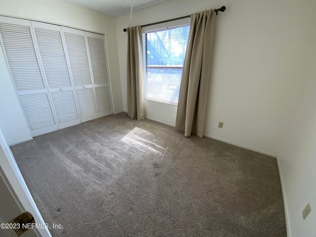 This room is on the front side of the condo | Image 6