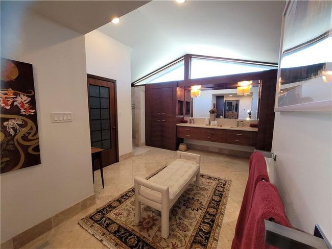 Bedroom with a sink and lofted ceiling | Image 33