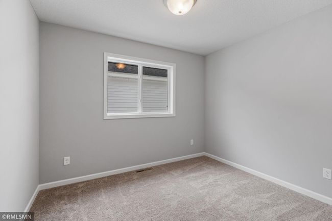 (Photo of previously finished home) Spacious loft leading to the hallway that connects to bedrooms two and three. | Image 14