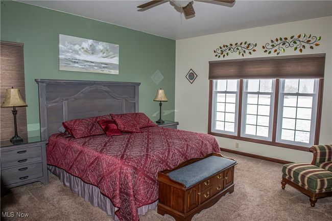 Carpeted bedroom with baseboards and ceiling fan | Image 10