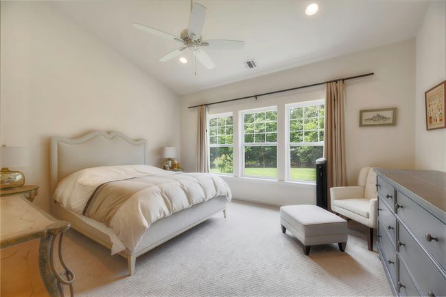 Bedroom featuring vaulted ceiling, light carpet, recessed lighting, and ceiling fan | Image 10