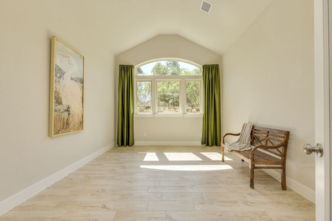 Office with french doors and vaulted ceilings across from kitchen | Image 17