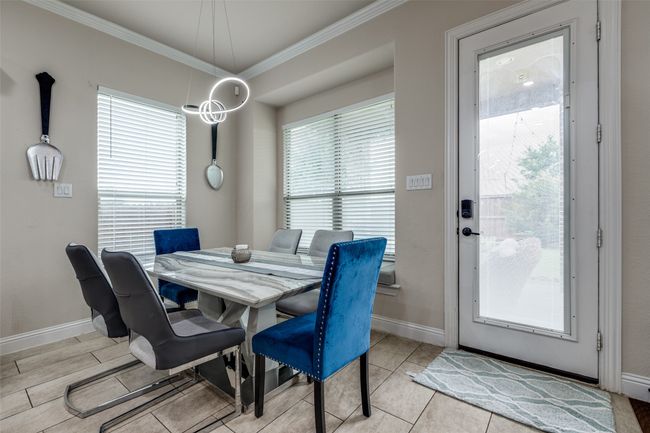 Dining area featuring crown molding and baseboards | Image 12